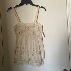 Cream colored crochet top the brand is French Connection